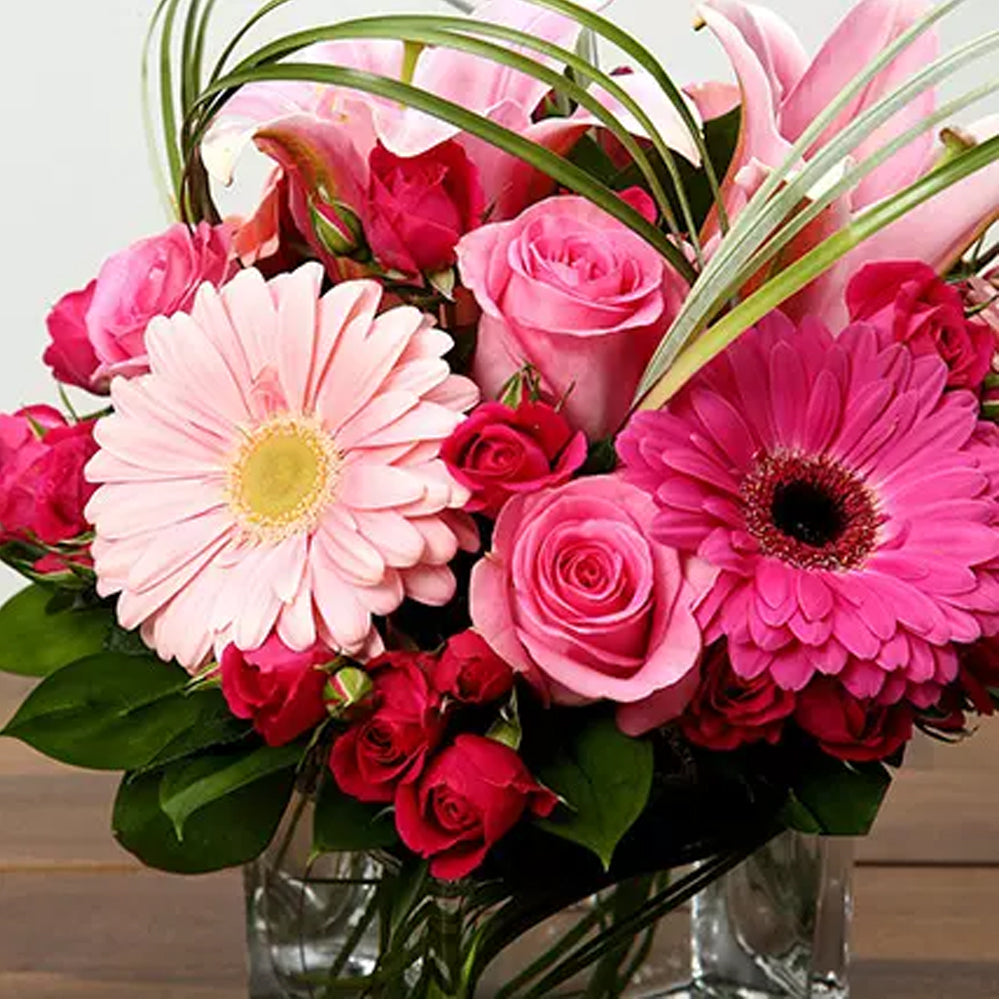 Onam - Roses and Gerbera Arrangement In Glass Vase