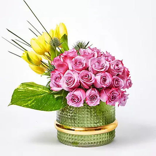 Ramadan - 12 Yellow Tulips 20 Purple Rose 3 Eryngium 1 Photo Leaf 5 Steel Grass 1 Green Vase Height : 25 cms